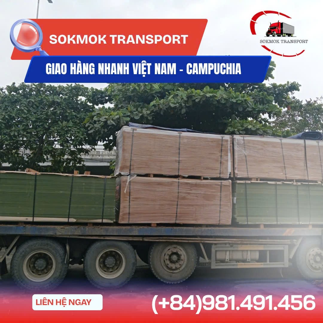 Two trucks driving on a highway under a blue sky with clouds