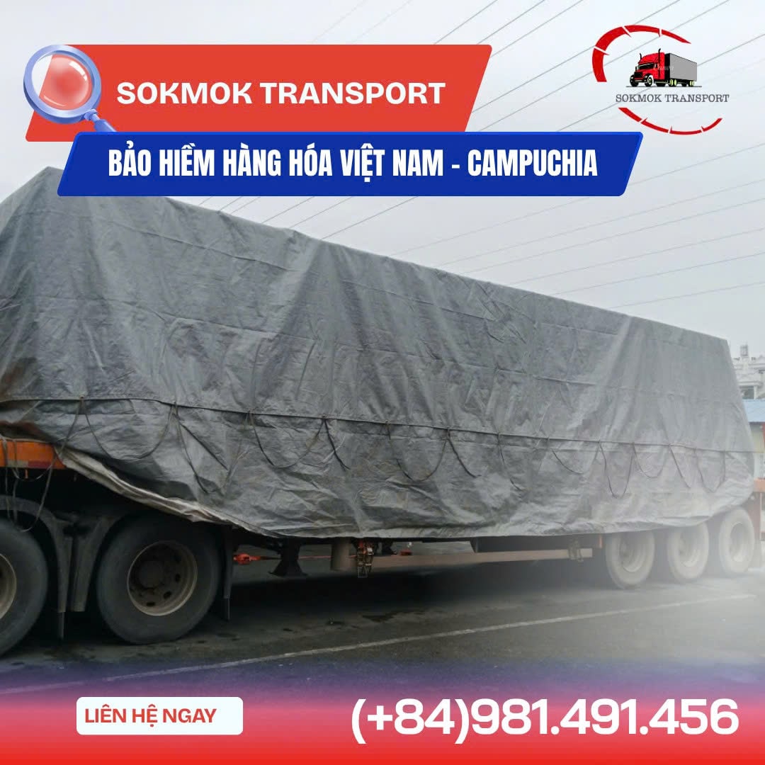 Cargo ship loaded with colorful containers sailing at sunset in harbor